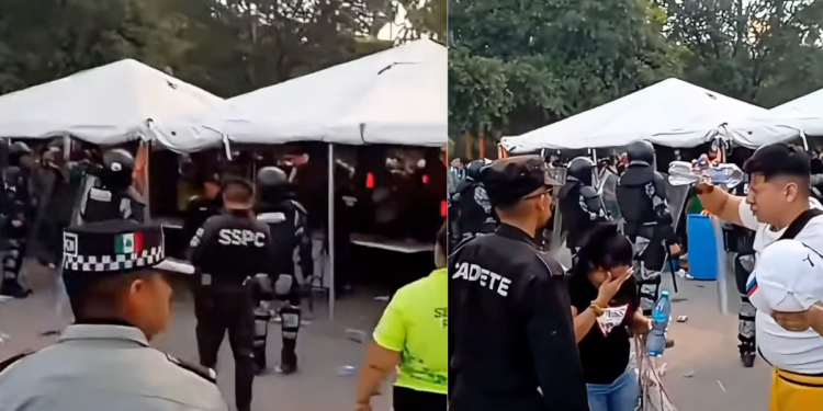 Crowd Under White Tents with Uniformed Security Personnel Monitoring an Outdoor Event Area. - Vecinos Unidos